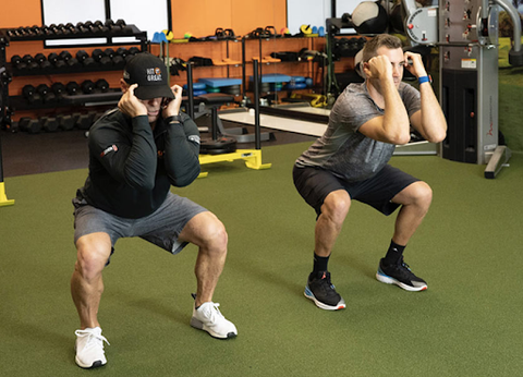 two guys doing exercises for golf